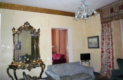 Yellow living room with seafront balcony